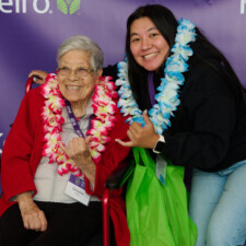 M PALMA PHOTO 2022 two women smiling with leis on