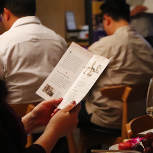 Attendee looking at brochure