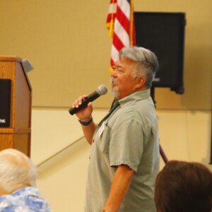 man speaking into micophone