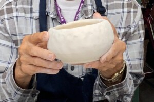First - John Okawa (89) man holding pottery bowl