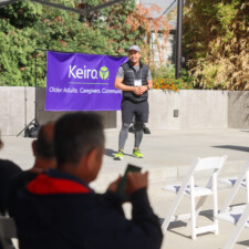 a man in black athletic clothing talking