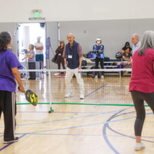 a group playing pickleball