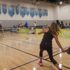 women playing pickleball