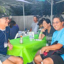 a man in blue laughing with a man in blue