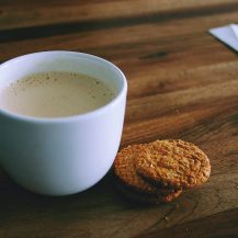 latte in a cup and cookies