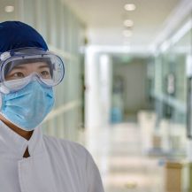 healthcare worker with mask and goggles at a hospital
