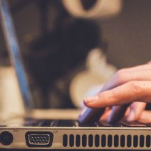 person typing on laptop