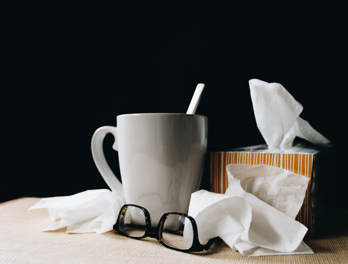 coffee cup surrounded by tissues