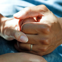 hand holding each other with care