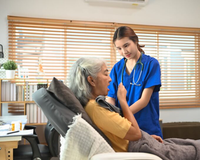 respiratory therapist helping patient