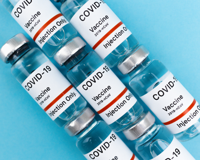 line of COVID-19 vaccine vials